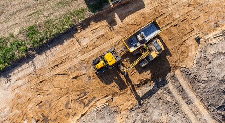 aerial view of excavator working on the field