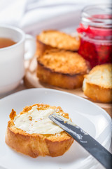 Toasts with butter and jam