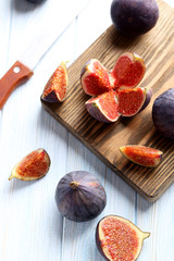 Fresh figs on a blue wooden table