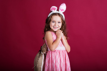 Obraz na płótnie Canvas Happy child girl is wearing pink ears, christmas time