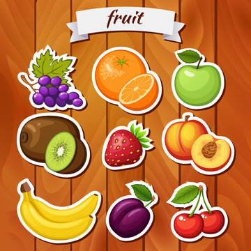 Fresh fruit on wooden background. Grape, orange, apple, kiwi, strawberry, peach, banana, plum, cherry
