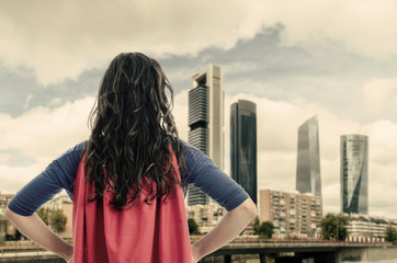 Woman superhero  in the city. Vintage color.