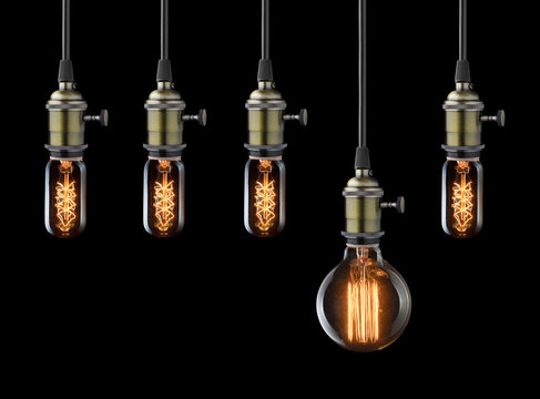 Idea concept. Vintage light bulbs on black