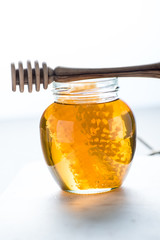 Jar with honey and comb
