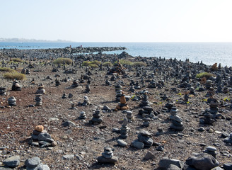 Art of stone balance, piles of stones on the beach. Tenerife