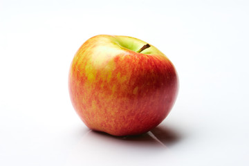 Fototapeta na wymiar Red and yellow apple on white