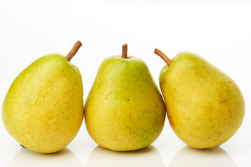 Three delicious pears on white