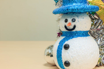 snowman,colorful Christmas decoration on wood background.