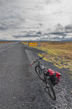 Lonely bike of a traveller on icelandic road, summer time