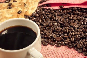 selective focus coffee ,cracker,coffee beans background.