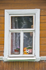 Fototapeta na wymiar window in old wooden house in Suzdal, Russia