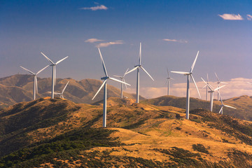 landscape with hills and wind turbines