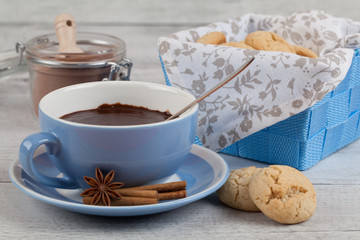 Hot chocolate on rustic background