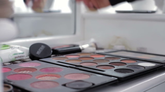 Big palette for make-up lying on the table indoors