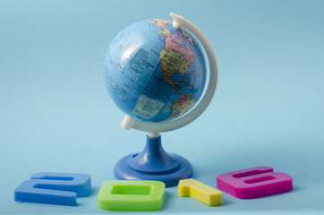 Globe with numbers for new year 2016 on blue background