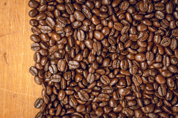 coffee bean on wood background.