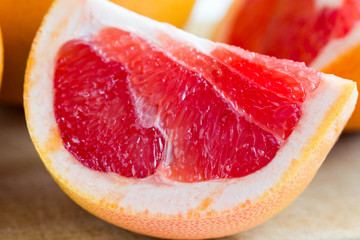 Closeup of a juicy red grapefruit slice.