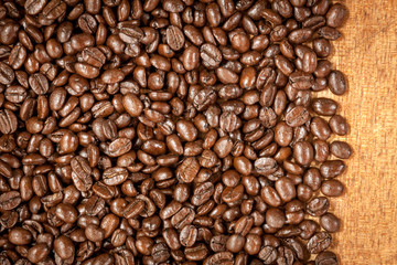 coffee bean on wood background.