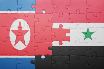 puzzle with the national flag of syria and north korea