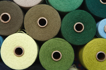 Color sewing threads as a background close up