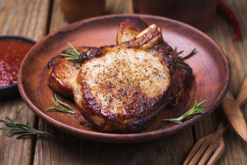 Baked pieces of pork in a clay plate