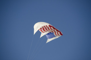american flag kite being flown on a nice day 