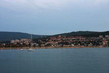Fototapeta premium Residential area on coastline, city Koper in Slovenia in the eve