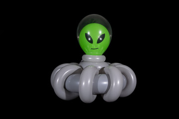 Inflated balloon alien in a spaceship