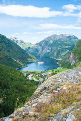 Big cruise ship sailing in a Norwegian fjord 