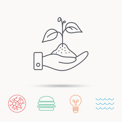 Save nature icon. Hand with plant sprout sign.