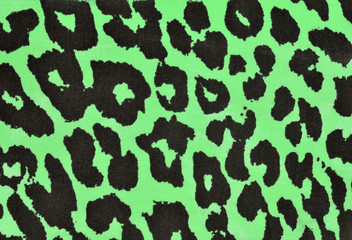 Black and green leopard fur pattern. Spotted animal print as background.