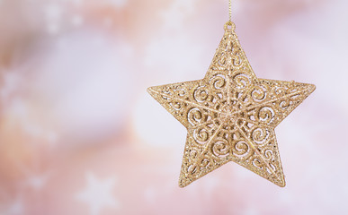 Gold Christmas Star on an Abstract Bright Background