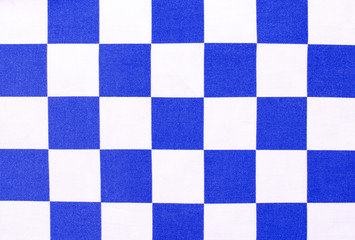 White and blue chequer background. Checker pattern on fabric.