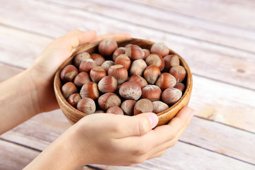 Hazelnuts in a wooden bowl