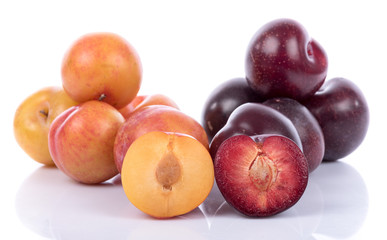 Ripe yellow and cherry plums