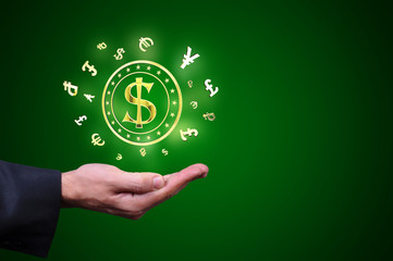 Currency gold symbols in a man hand