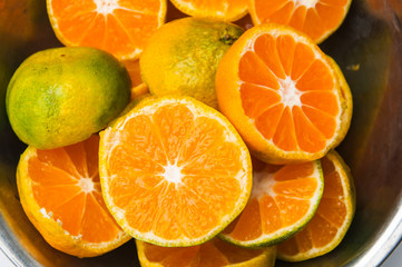 Naklejka na ściany i meble Sliced orange fruit for orange juicy