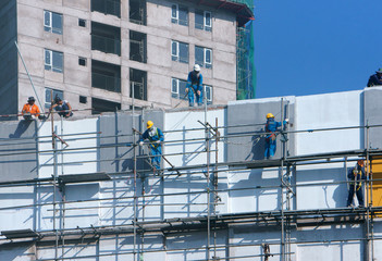 Asian construction worker scraffold, building site