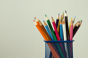 color pencil box on wooden table