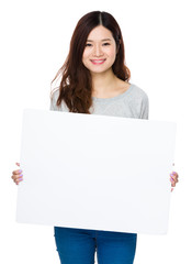 Fototapeta premium Young Woman show with the white banner