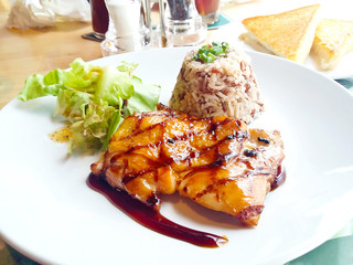Chicken steak in a dish Serve with rice