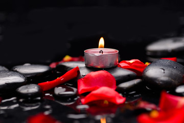 Set of Red rose petals with candle and therapy stones 