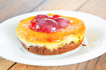 Fruit Cake on Vintage Retro Background.