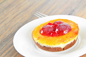 Fruit Cake on Vintage Retro Background.