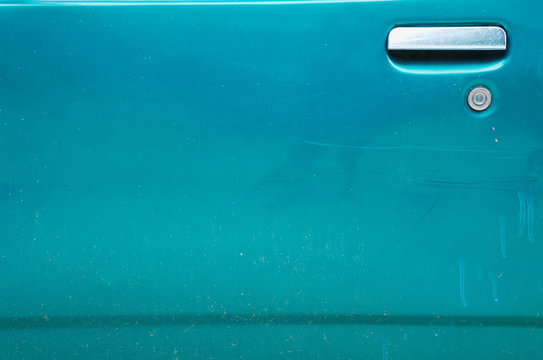 Dirty Car Door Handle On A Dark Green Door