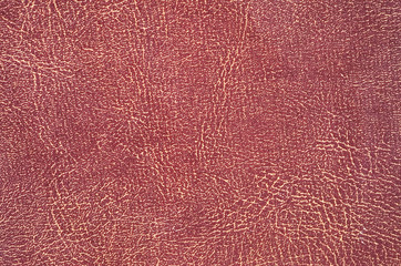 Fototapeta premium Closeup detail on old red and brown leather texture background