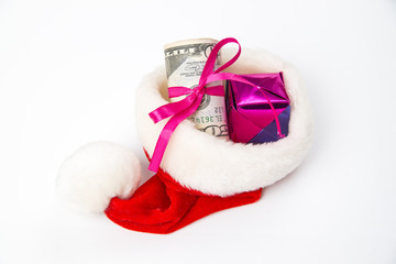 Santa hat and money. Isolated on white background