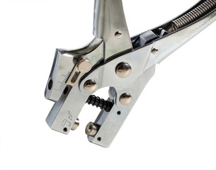 perforation device on a white background, macro