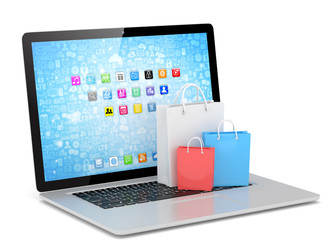 laptop and  shopping pags on white background