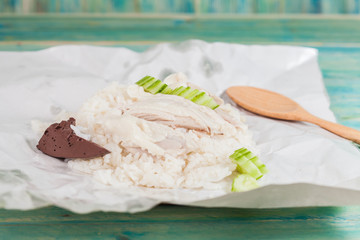 sliced Hainan-style chicken with marinated rice in